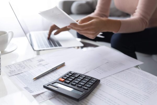 person paying bills online seven hills consulting blog